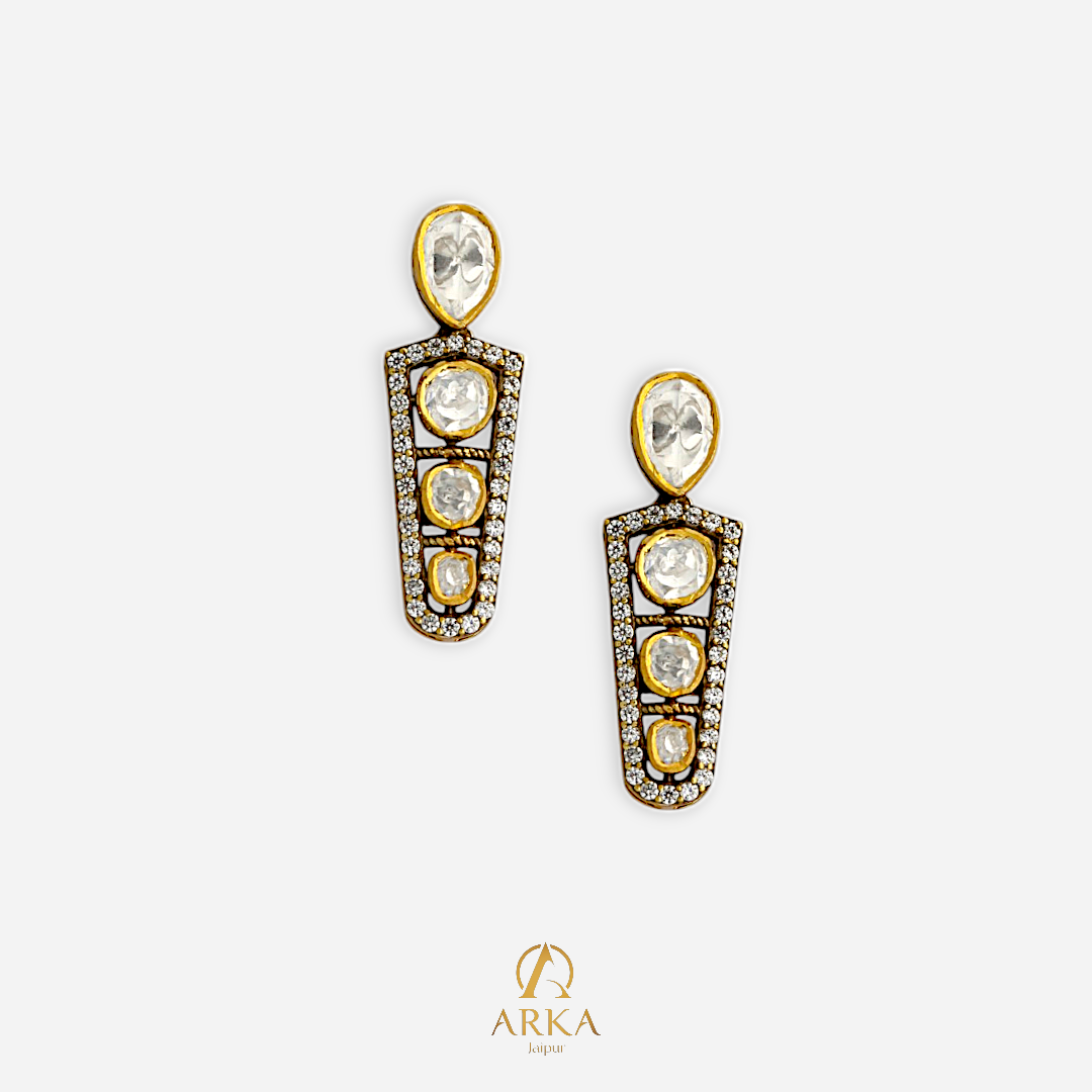 “Cascade of Light Earrings by ARKA Jaipur – handcrafted golden earrings with uncut polki diamonds and diamond pave border in sterling silver, luxury designer jewelry from Jaipur.”
