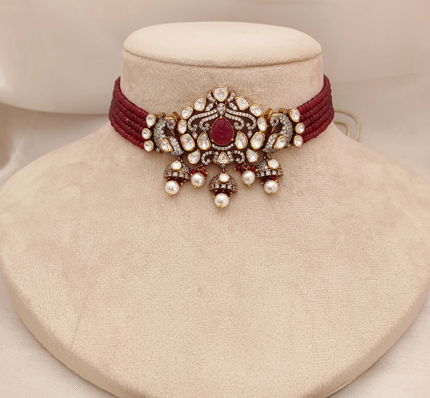 Crimson Vogue Set by Arka Jaipur featuring ruby kundan drop earrings and a maroon thread choker with pearl and stone embellishments, styled for pre-wedding celebrations.