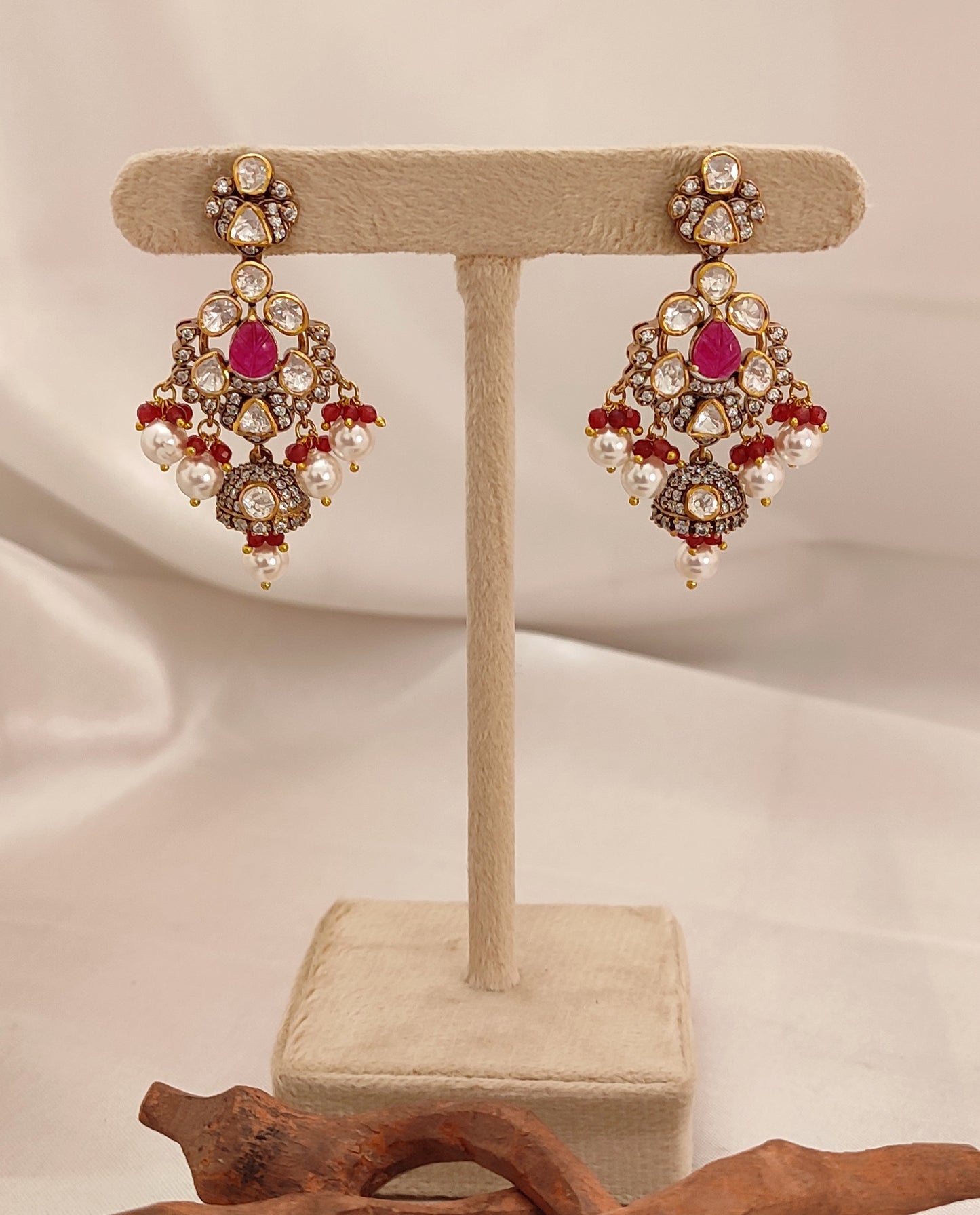 Crimson Vogue Set by Arka Jaipur featuring ruby kundan drop earrings and a maroon thread choker with pearl and stone embellishments, styled for pre-wedding celebrations.