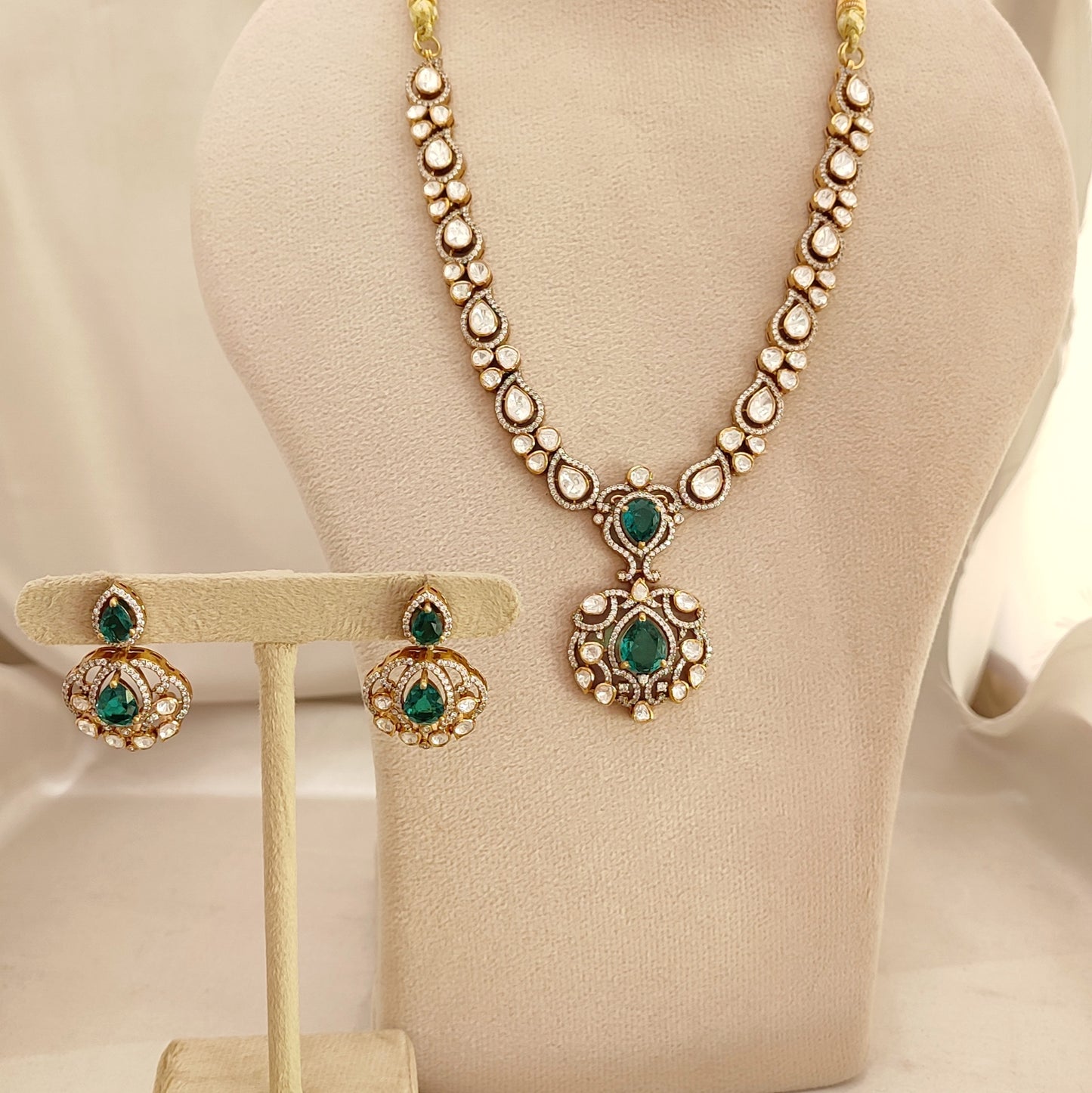Arka Jaipur emerald green kundan polki necklace set with matching earrings in sterling silver”
“Designer Indian bridal jewelry set with emerald stones and polki kundan work by Arka Jaipur”
“Luxury sterling silver necklace and earrings with emerald green accents and kundan detailing”
“Traditional Indian bridal emerald kundan polki jewelry set by Arka Jaipur”
