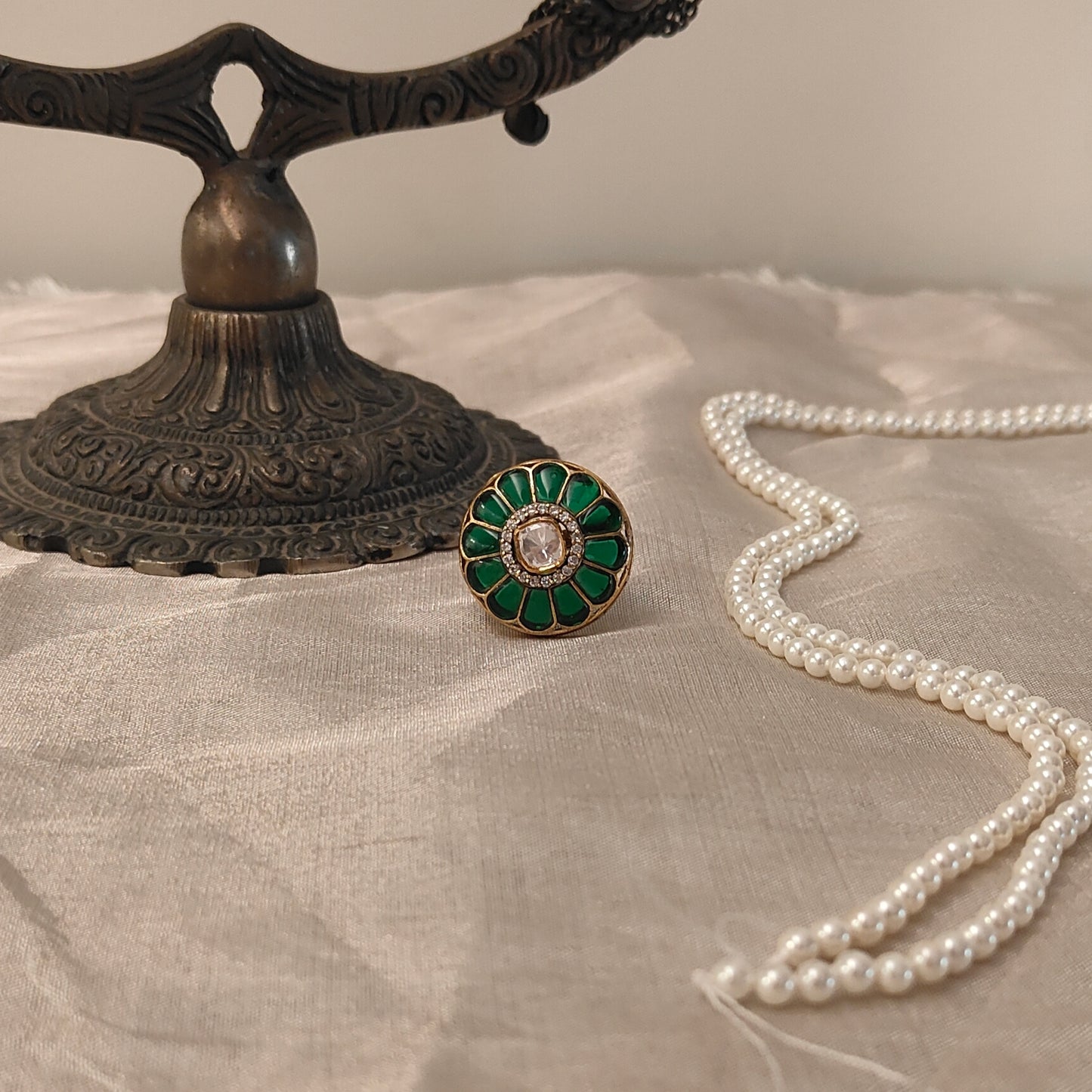 Green enamel floral Gulnar Ring with Polki center stone and crystal halo, set in gold-tone finish in 925 sterling silver, handcrafted traditional design by Arka Jaipur.