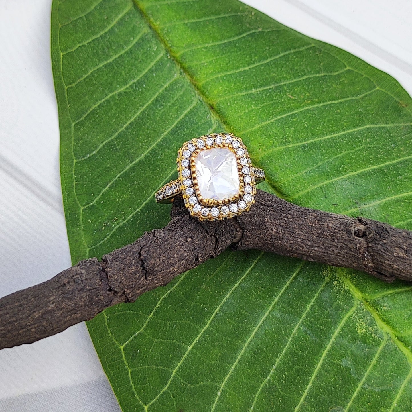 Luminara-Ring Gold plated ring in sterling silver with a diamond on a green leaf by Arka Jaipur