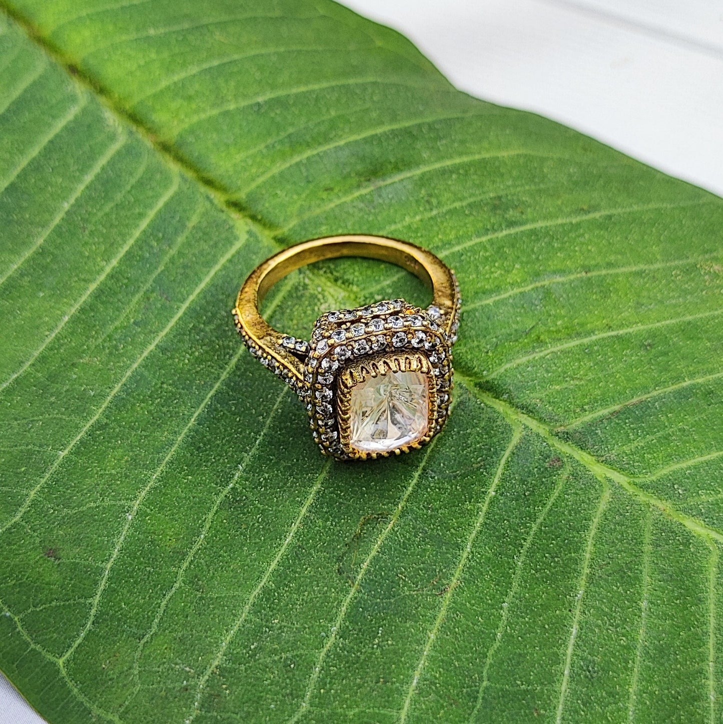 Luminara-Ring Gold plated ring in sterling silver with a diamond on a green leaf by Arka Jaipur