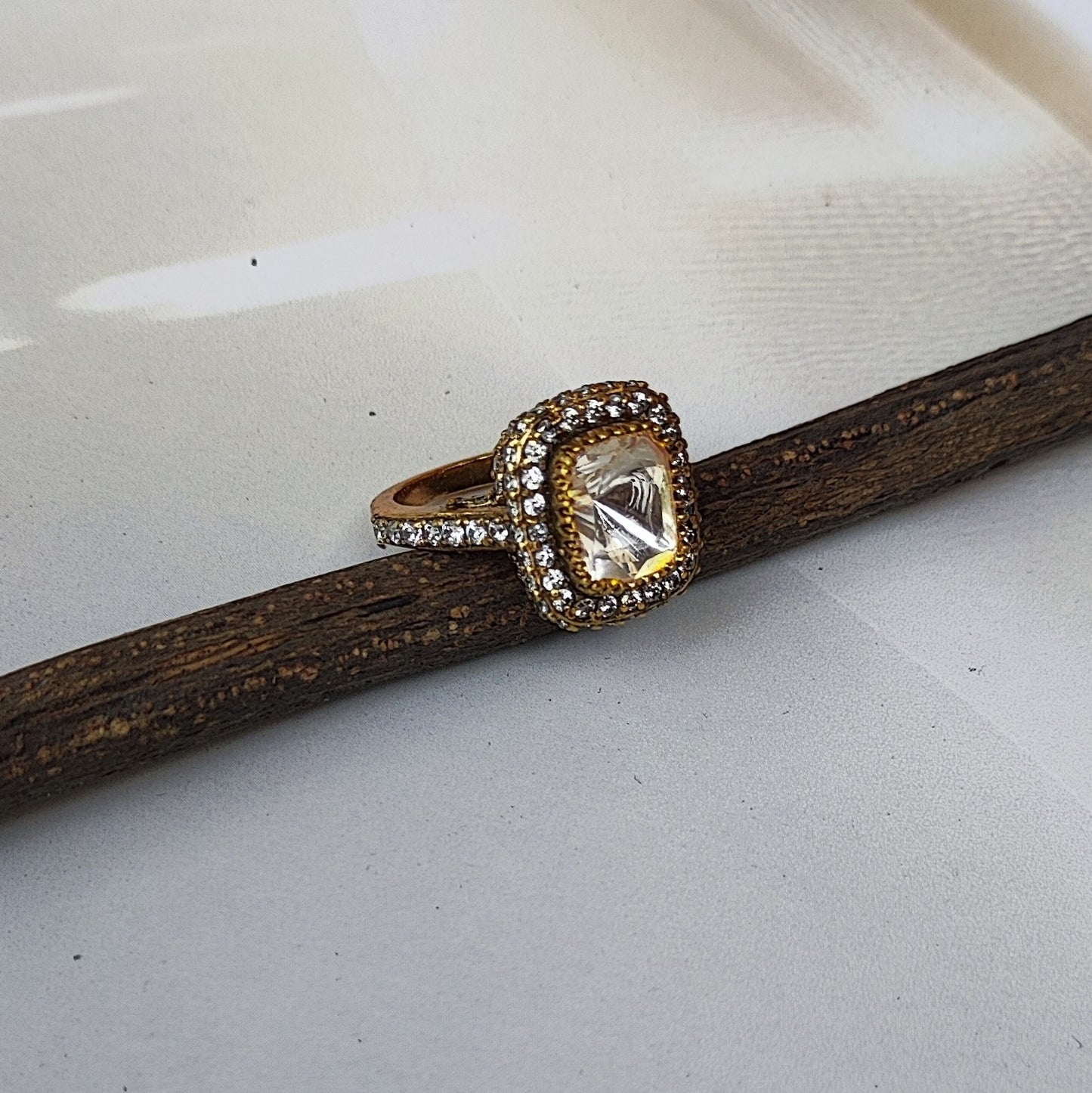 Luminara-Ring Gold plated ring in sterling silver with a diamond on a green leaf by Arka Jaipur