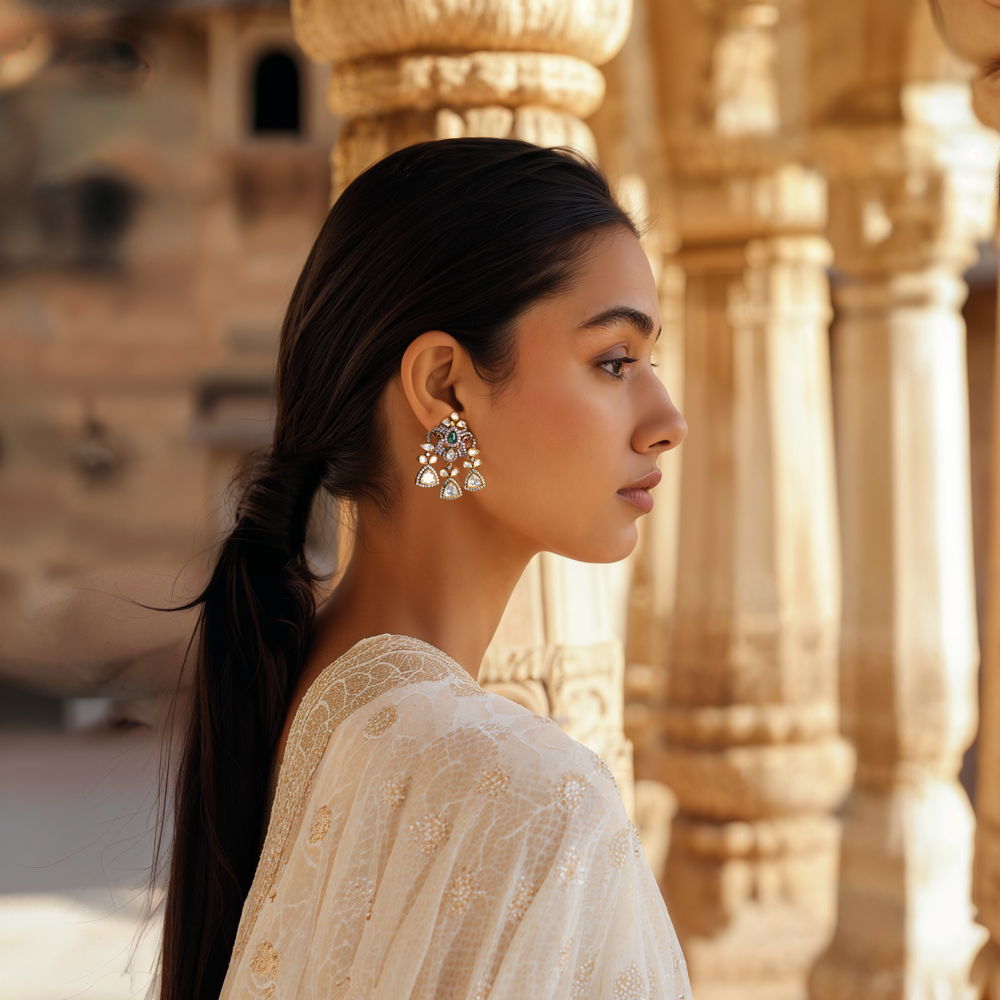 Mor Parikhan gold-plated chandelier earrings by Arka Jaipur featuring green stone center, moissanite embellishments, and peacock-inspired Indian design – ideal for bridal and festive wear.