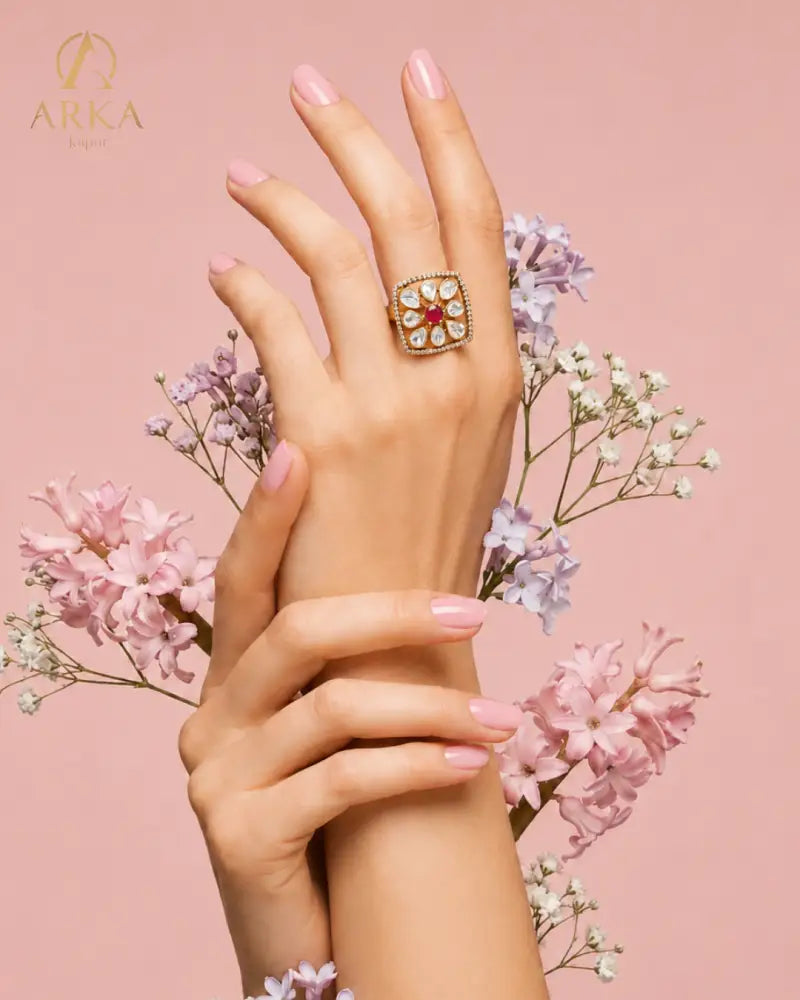 Floral statement ring with ruby pink center stone and moissanite polki stones by Arka Jaipur