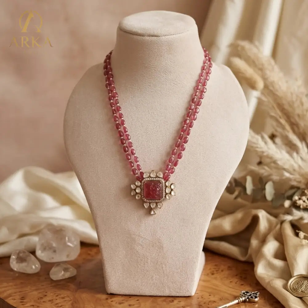 Carved Aura Red Ruby Necklace with Floral Engraved Stone and Two-Tier Bead Chain by Arka Jaipur