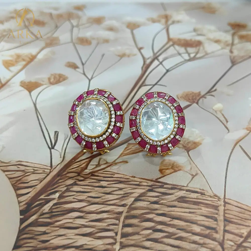 Traditional Indian stud earrings Celistra by Arka Jaipur featuring a large central moissanite stone, surrounded by ruby red and kundan-style stones.