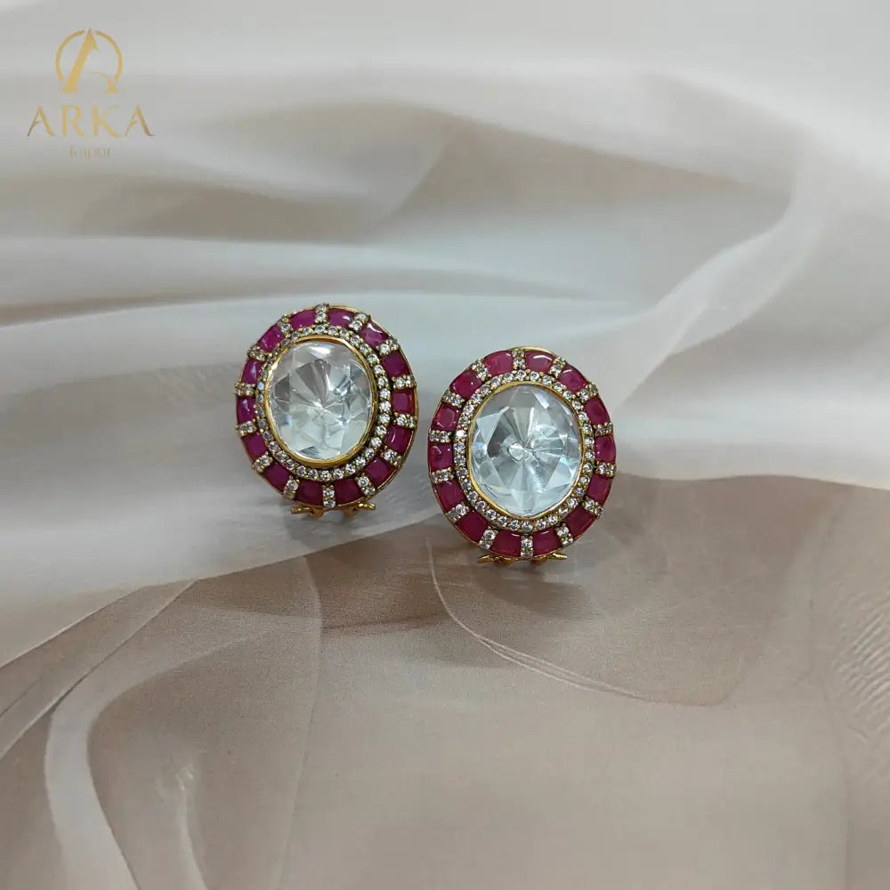 Traditional Indian stud earrings Celistra by Arka Jaipur featuring a large central moissanite stone, surrounded by ruby red and kundan-style stones.