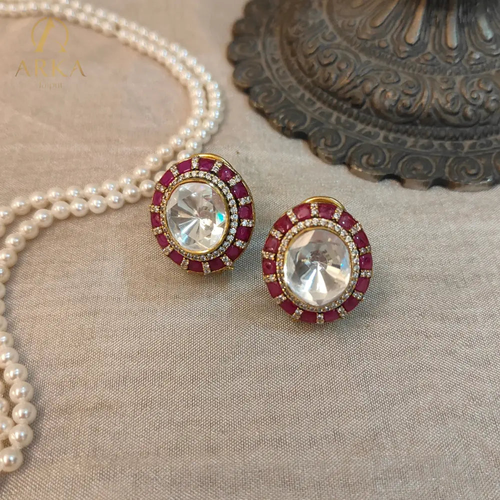 Traditional Indian stud earrings Celistra by Arka Jaipur featuring a large central moissanite stone, surrounded by ruby red and kundan-style stones.