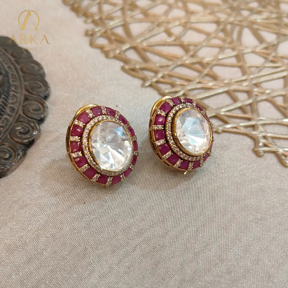 Traditional Indian stud earrings Celistra by Arka Jaipur featuring a large central moissanite stone, surrounded by ruby red and kundan-style stones.