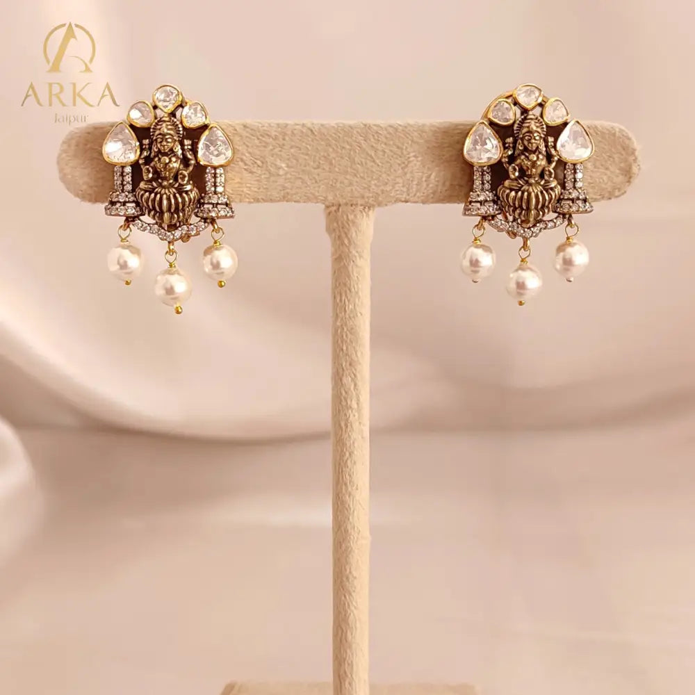 Devi Earrings | Moissanite & Pearl Antique Gold coloure Earrings by Arka Jaipur, handcrafted antique gold coloured earrings with moissanite, CZ diamonds, and pearl drops. A perfect blend of tradition and elegance for festive and wedding wear.