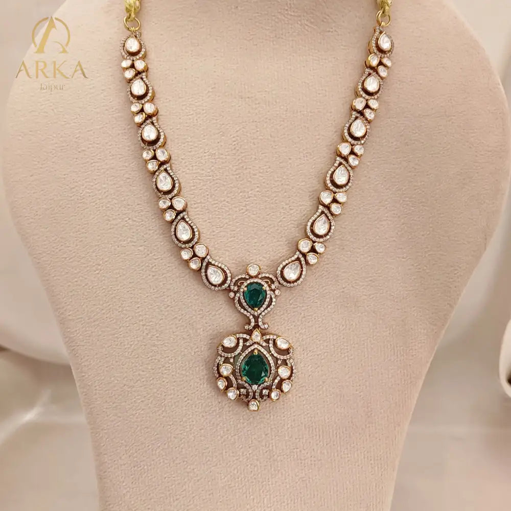 Arka Jaipur emerald green kundan polki necklace set with matching earrings in sterling silver”
“Designer Indian bridal jewelry set with emerald stones and polki kundan work by Arka Jaipur”
“Luxury sterling silver necklace and earrings with emerald green accents and kundan detailing”
“Traditional Indian bridal emerald kundan polki jewelry set by Arka Jaipur”