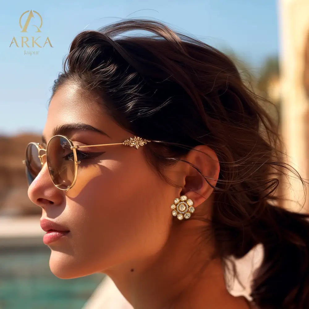 Arka Jaipur Floral Fiesta gold-plated stud earrings with kundan-style polki stones in a floral design, traditional Indian bridal and festive jewelry