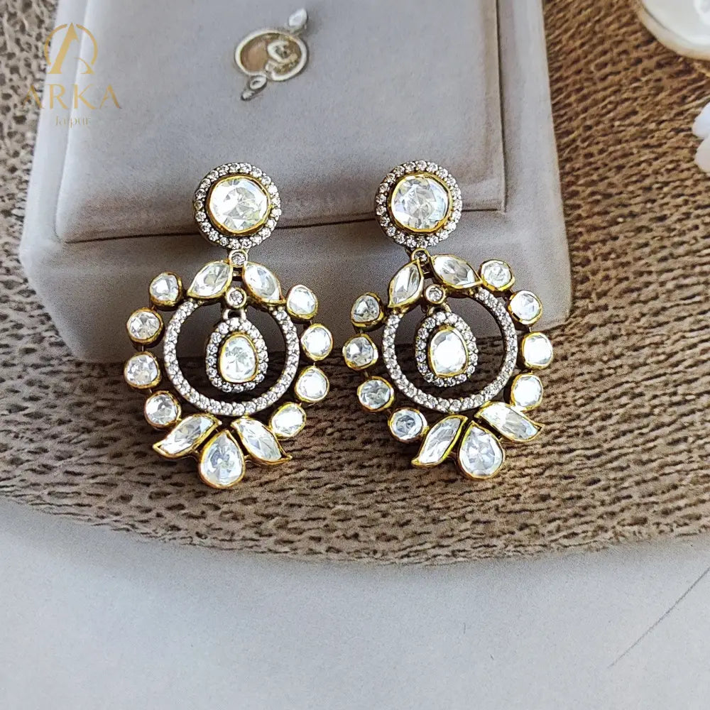 "Polki halo earrings in gold polished silver with teardrop and round stones by Arka Jaipur","Traditional handcrafted Polki earrings with CZ detailing from Arka Jaipur","Designer Indian Polki dangler earrings in circular halo design by Arka Jaipur"