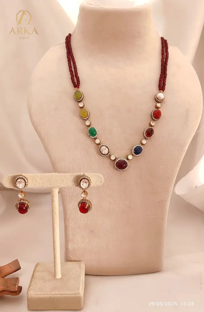 " Navratna Radiance kundan necklace & Earrings set by Arka Jaipur with nine colorful gemstones and matching earrings traditional Indian jewelry"