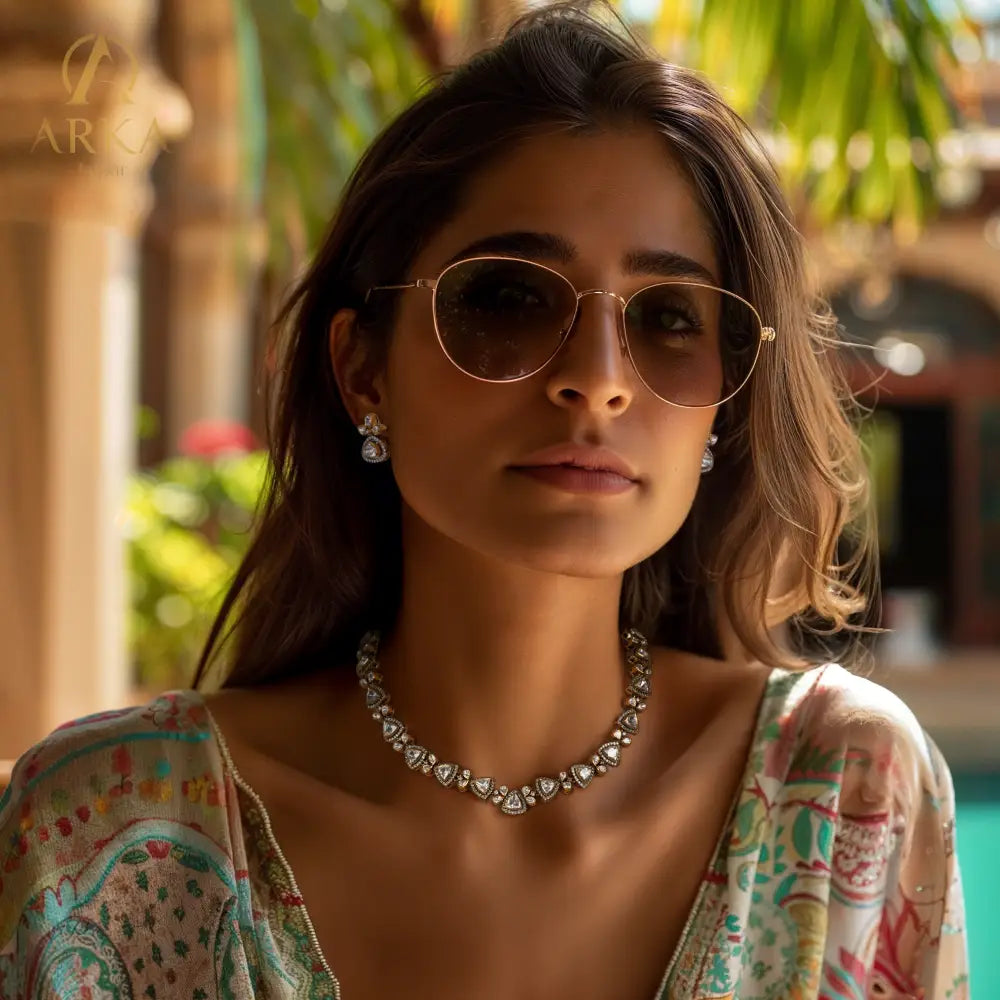 Petals of Paradise necklace and earring set by Arka Jaipur, featuring triangular kundan-style stones with zircon borders and gold petal accents in a handcrafted, traditional design.