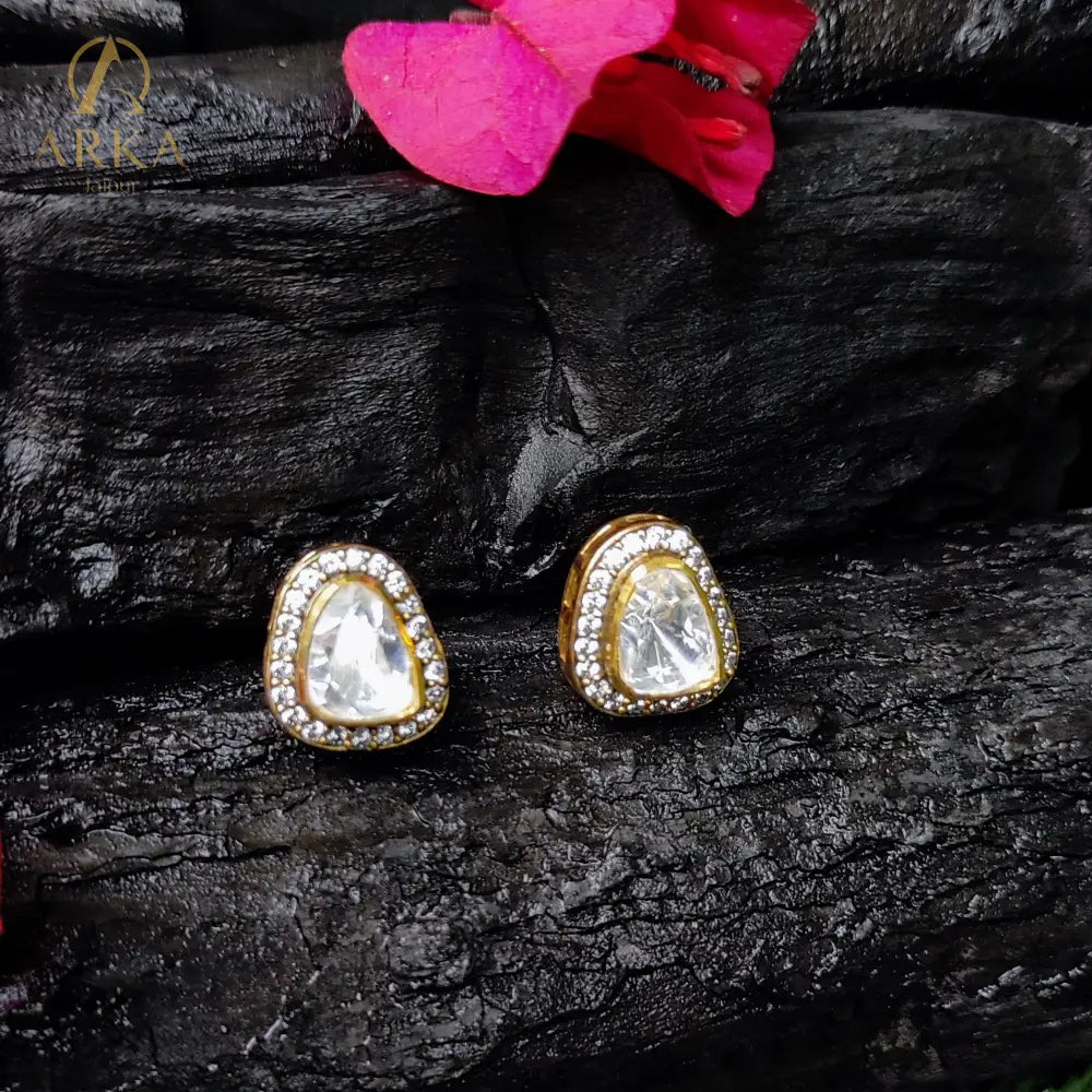 Twilight Triad studs by Arka Jaipur – asymmetrical triangle moissanite studs in silver with pavé halo setting.