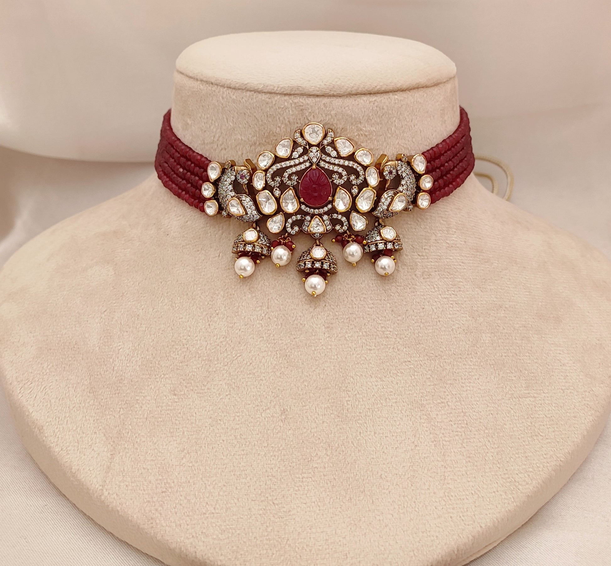 Crimson Vogue Set by Arka Jaipur featuring ruby kundan drop earrings and a maroon thread choker with pearl and stone embellishments, styled for pre-wedding celebrations.