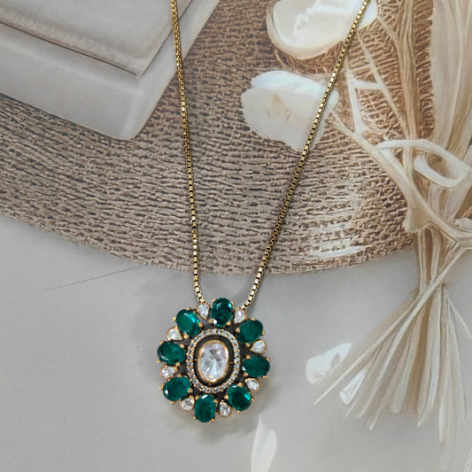“Arka Jaipur luxury emerald polki pendant in sterling silver with gold-toned chain”

“Designer pendant with green emerald stones and polki centerpiece by Arka Jaipur”

“Indian heritage emerald blossom pendant in sterling silver jewelry”

“Luxury bridal jewelry pendant with emerald and polki by Arka Jaipur”