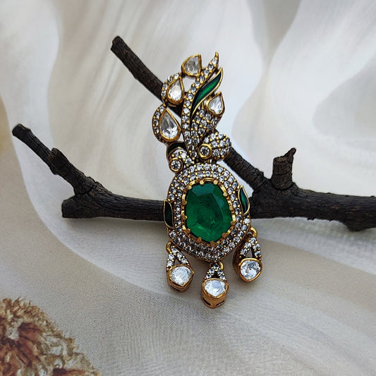 Emerald-Éclat ,Handcrafted emerald and polki diamond brooch by Arka Jaipur

Luxury designer brooch with oval emerald center and pavé diamond drop

Rajasthani heritage-inspired emerald polki brooch by Arka Jaipur

Gold and polki diamond brooch with emerald centerpiece and gemstone detailing