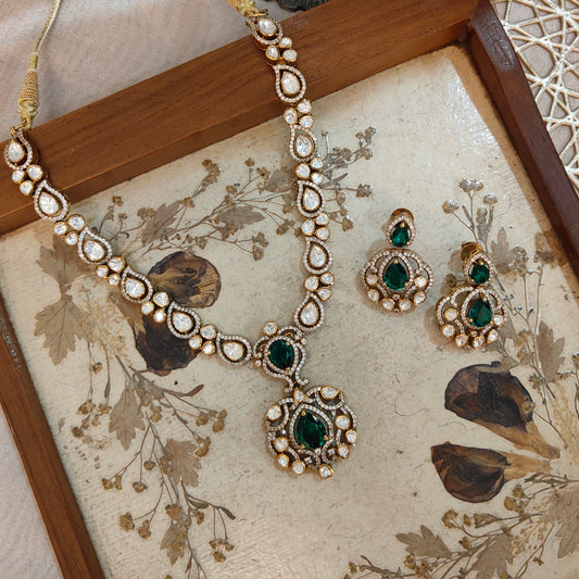 Arka Jaipur emerald green kundan polki necklace set with matching earrings in sterling silver”

“Designer Indian bridal jewelry set with emerald stones and polki kundan work by Arka Jaipur”

“Luxury sterling silver necklace and earrings with emerald green accents and kundan detailing”

“Traditional Indian bridal emerald kundan polki jewelry set by Arka Jaipur”