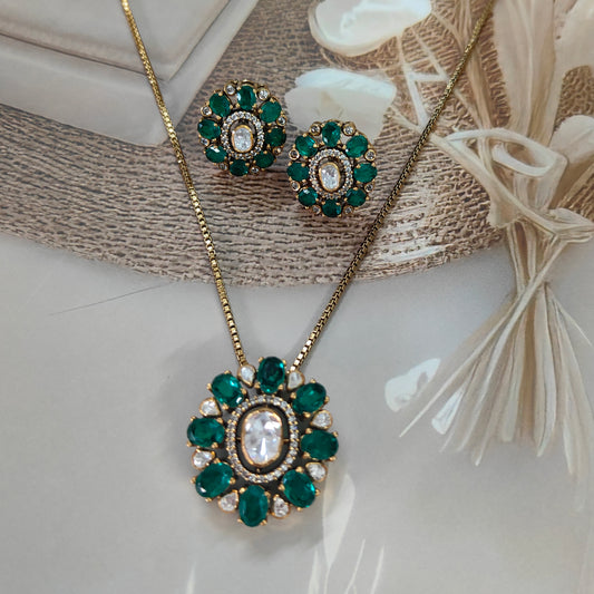 “Arka Jaipur luxury emerald polki pendant earrings set in sterling silver with gold-toned chain”

“Designer pendant earrings set  with green emerald stones and polki centerpiece by Arka Jaipur”

“Indian heritage emerald regalia pendant earrings set in sterling silver jewelry”

“Luxury bridal jewelry pendant with emerald and polki by Arka Jaipur”