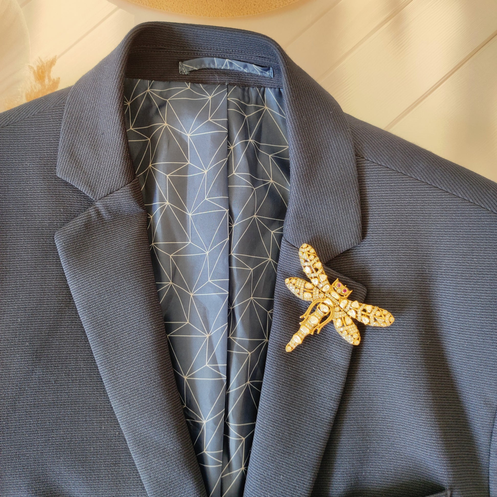 Handcrafted dragonfly brooch with uncut polki diamonds and ruby eyes by Arka Jaipur

Luxury gold dragonfly brooch inspired by Rajasthani architecture

Designer statement polki diamond brooch by Arka Jaipur

Heritage-inspired dragonfly jewelry brooch with rubies and polki