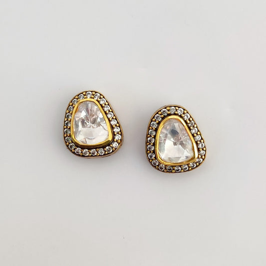 Twilight Triad studs by Arka Jaipur – asymmetrical triangle moissanite studs in silver with pavé halo setting.