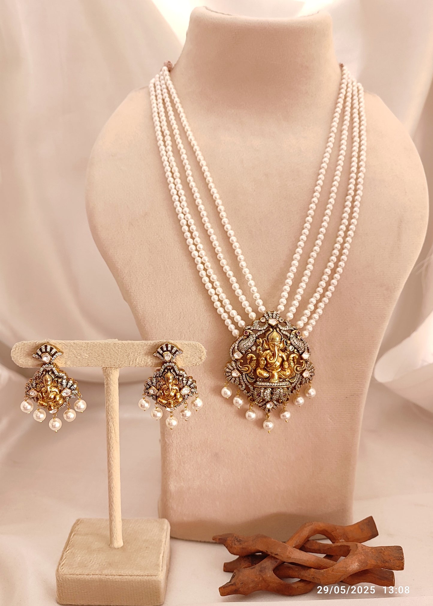 Iraj Set featuring Lord Ganesha motif pearl necklace with matching earrings in antique finish, traditional Indian temple jewellery set for festive and bridal wear