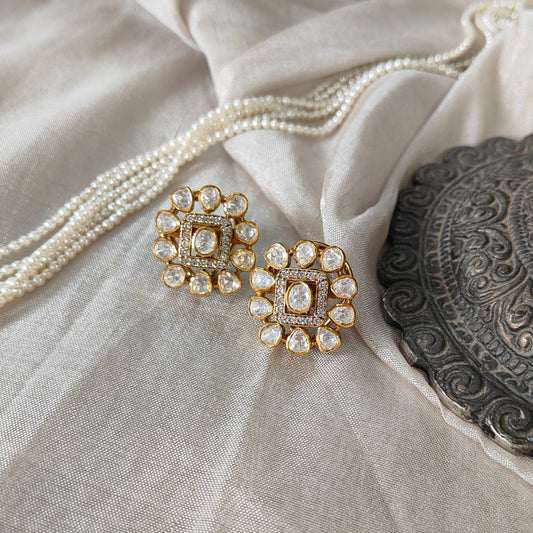 Ivory Halo Studs with square polki center and halo design in a luxury flatlay