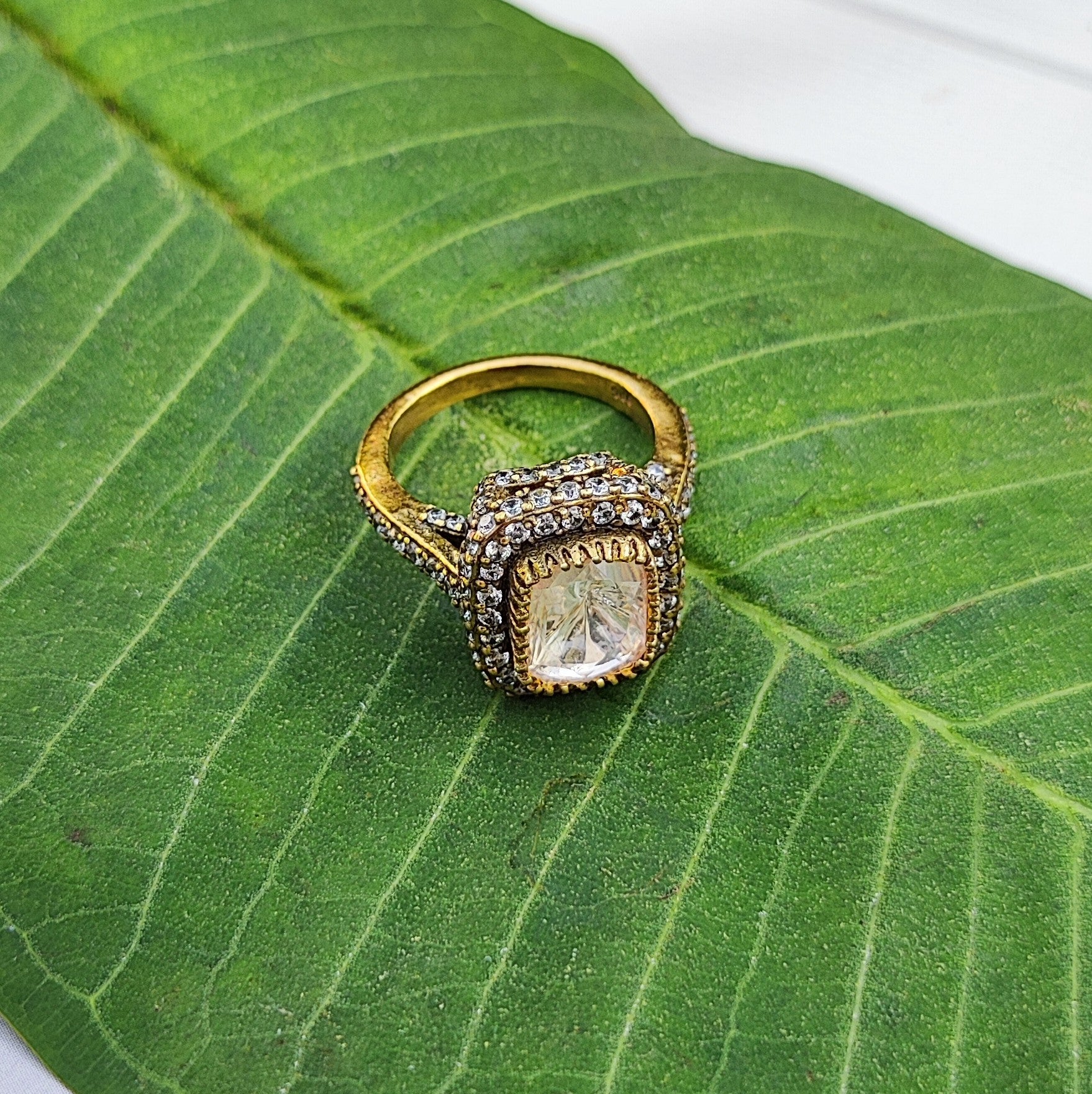 Luminara-Ring Gold  plated ring in sterling silver with a diamond on a green leaf by Arka Jaipur
