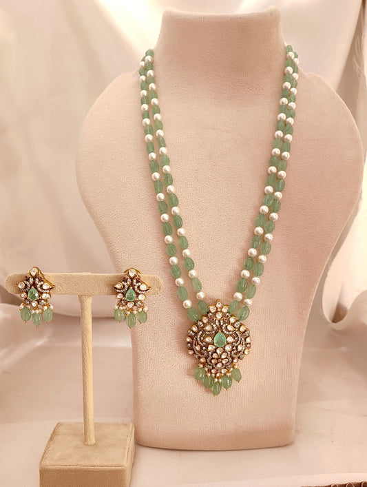 Meher-e-Panna silver jewelry set with green stones and pearls