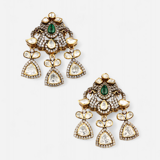 Mor Parikhan gold-plated chandelier earrings by Arka Jaipur featuring green stone center, moissanite embellishments, and peacock-inspired Indian design – ideal for bridal and festive wear.