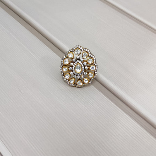 “Polki Blossom Ring by Arka Jaipur with uncut Polki stones in a floral design, teardrop centre stone, kundan-style detailing, and crystal halo photographed on a beige textured background.”