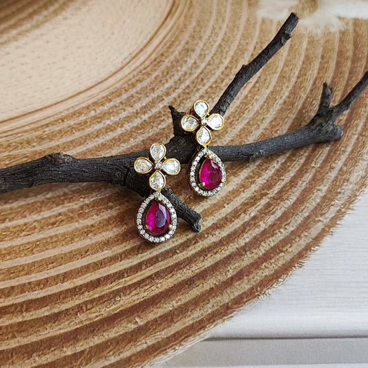 Ruby Blossom Earrings by Arka Jaipur – gold earrings with floral polki diamond design and teardrop ruby gemstone surrounded by diamond halo
