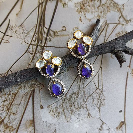 Handcrafted Violet Majesty gold-plated earrings with violet teardrop stones and polki crystals by Arka Jaipur. Perfect for weddings, parties, and festive elegance.