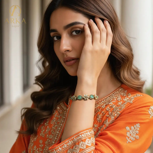 "Aureya Bracelet Bracelet Luxury emerald kundan floral bracelet by Arka Jaipur, handcrafted Indian jewelry with antique gold finish"