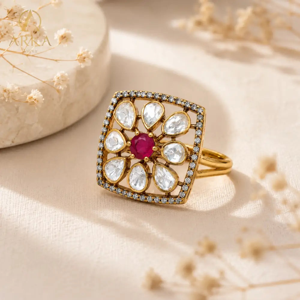 Floral statement ring with ruby pink center stone and moissanite polki stones by Arka Jaipur