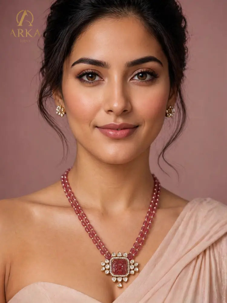 Carved Aura Red Ruby Necklace with Floral Engraved Stone and Two-Tier Bead Chain by Arka Jaipur