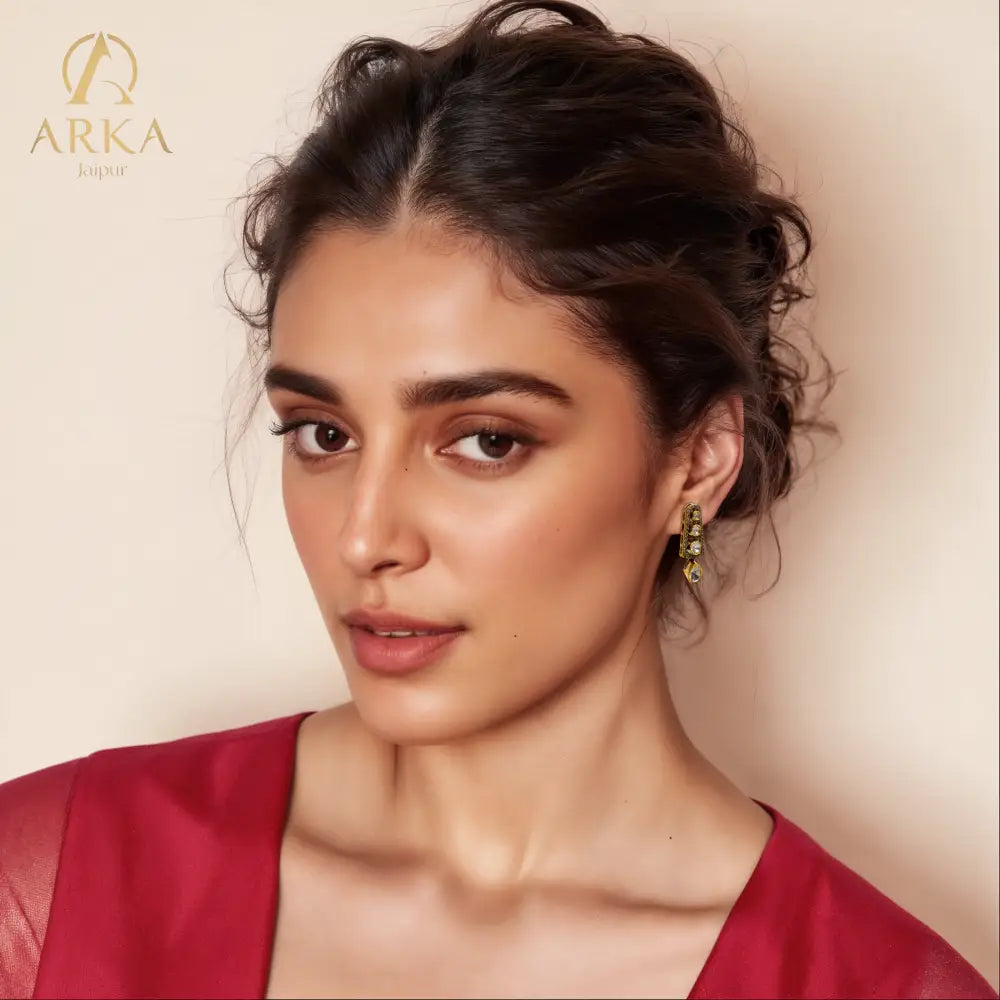 “Cascade of Light Earrings by ARKA Jaipur – handcrafted golden earrings with uncut polki diamonds and diamond pave border in sterling silver, luxury designer jewelry from Jaipur.”