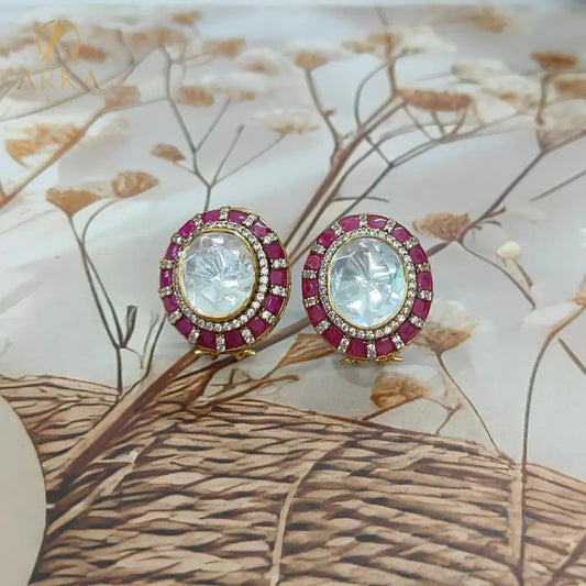 Traditional Indian stud earrings Celistra by Arka Jaipur featuring a large central moissanite stone, surrounded by ruby red and kundan-style stones.
