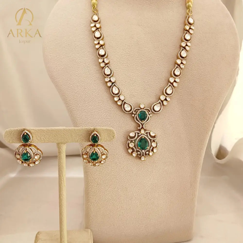 Arka Jaipur emerald green kundan polki necklace set with matching earrings in sterling silver”

“Designer Indian bridal jewelry set with emerald stones and polki kundan work by Arka Jaipur”

“Luxury sterling silver necklace and earrings with emerald green accents and kundan detailing”

“Traditional Indian bridal emerald kundan polki jewelry set by Arka Jaipur”