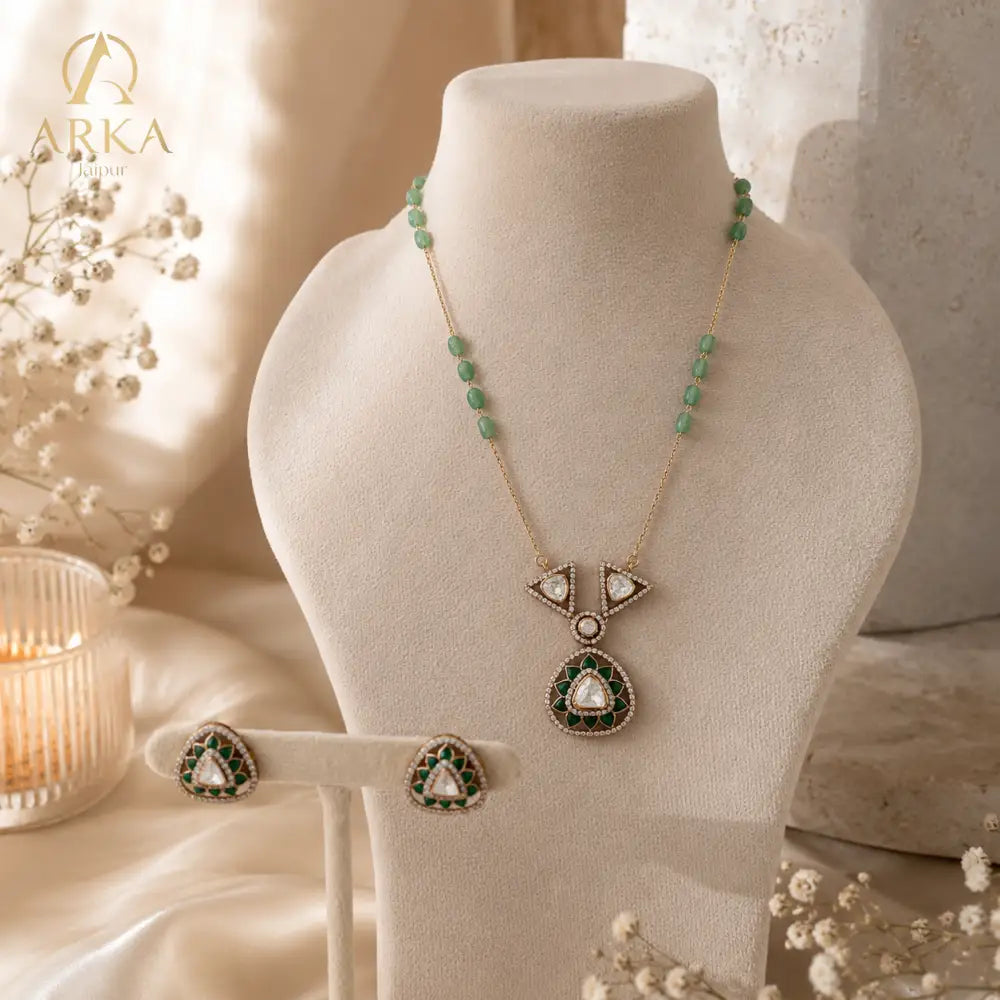 Emerald green polki pendant set with matching stud earrings in sterling silver by Arka Jaipur