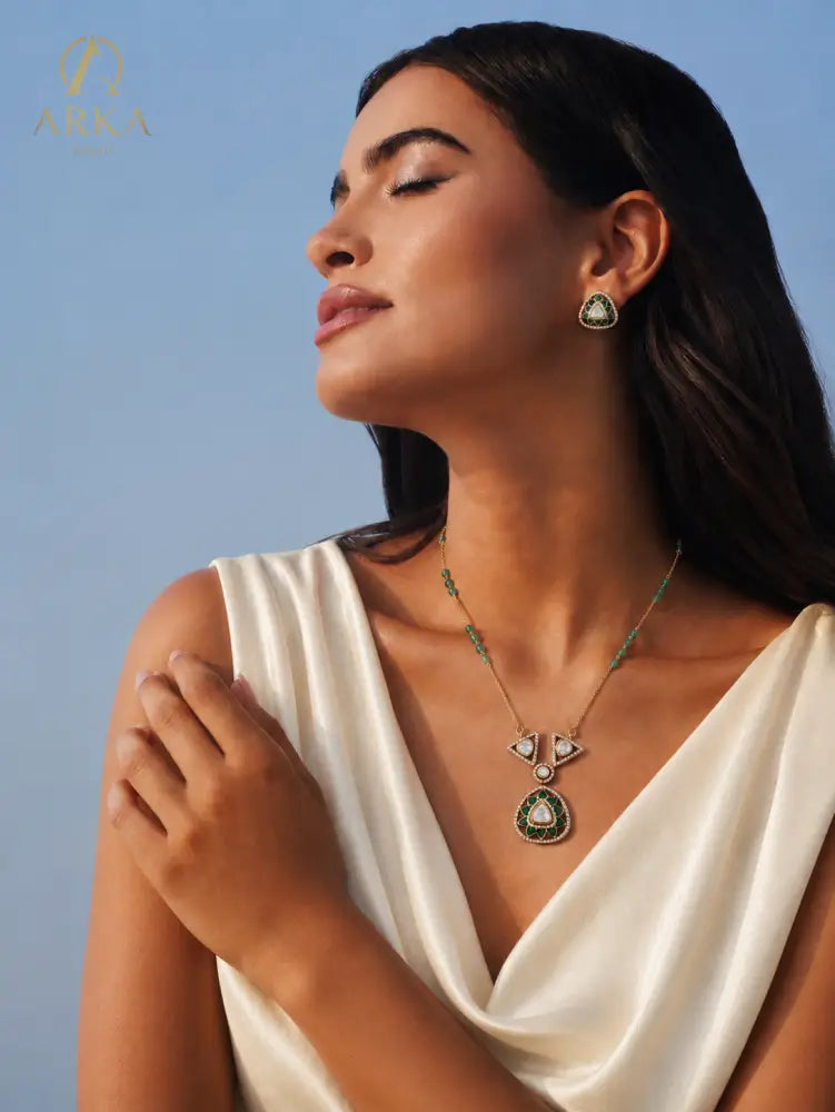 Emerald green polki pendant set with matching stud earrings in sterling silver by Arka Jaipur