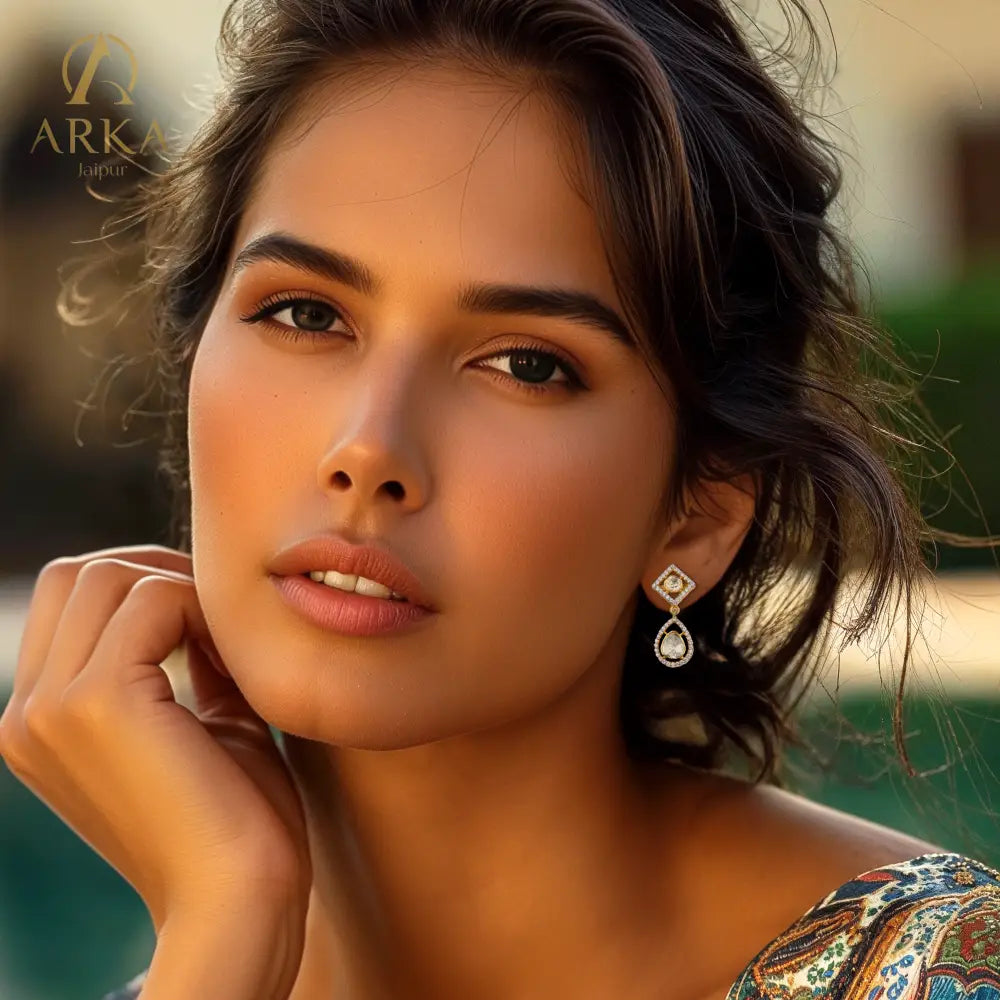 Arka Jaipur Equilibrium Elegance earrings with kundan-style polki stones, teardrop and diamond-shaped design, gold-plated finish, and crystal accents for bridal and festive wear