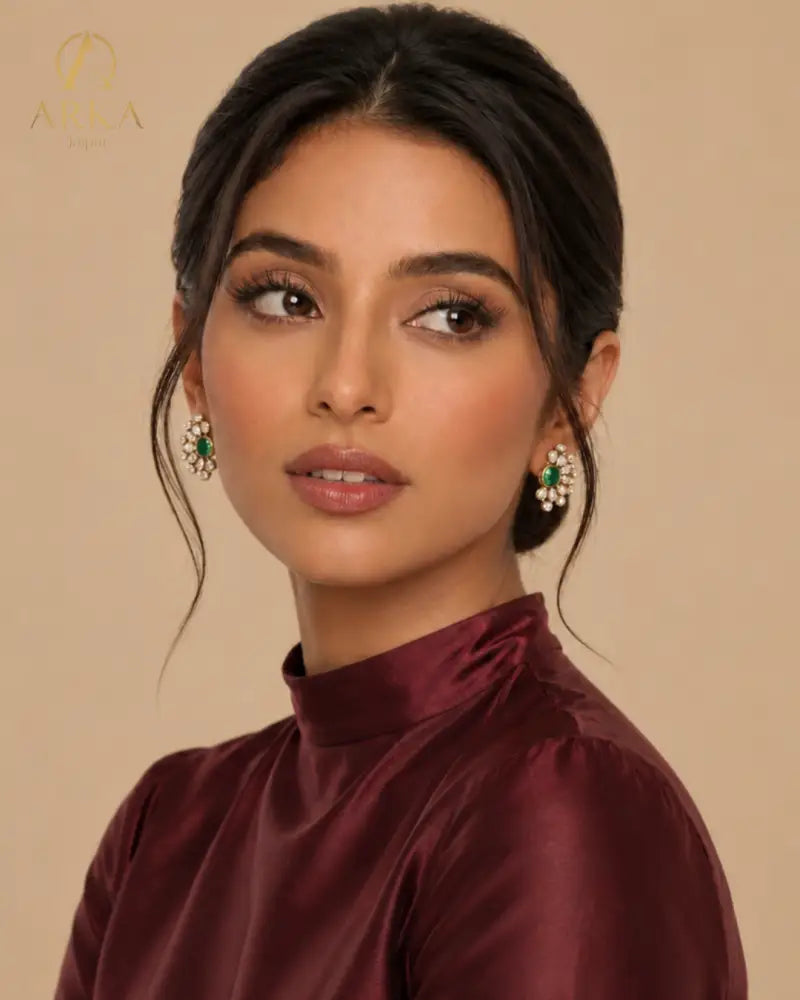 Contemporary green statement stud earrings with moissanite polki petal detailing and gold finish, elegant modern jewelry for women by Arka Jaipur