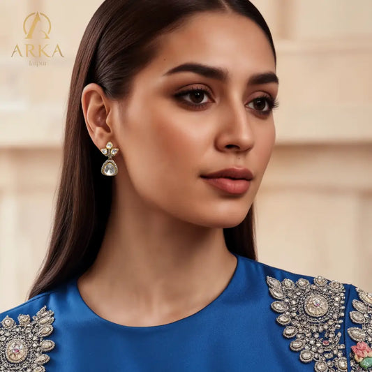 "Lotus Dewdrop Earrings by Arka Jaipur featuring uncut polki-style stones in lotus petal and teardrop shapes, antique gold finish with crystal accents, handcrafted Indian designer jewelry"