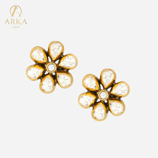 Floral-shaped Petal Radiance Stud earrings by Arka Jaipur, featuring six kundan-style petal stones with a central white stone in an antique gold setting