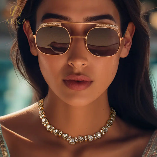 Petals of Paradise necklace by Arka Jaipur, showcasing triangular kundan-style stones bordered with white zircons and gold petal embellishments in a regal, handcrafted design.

